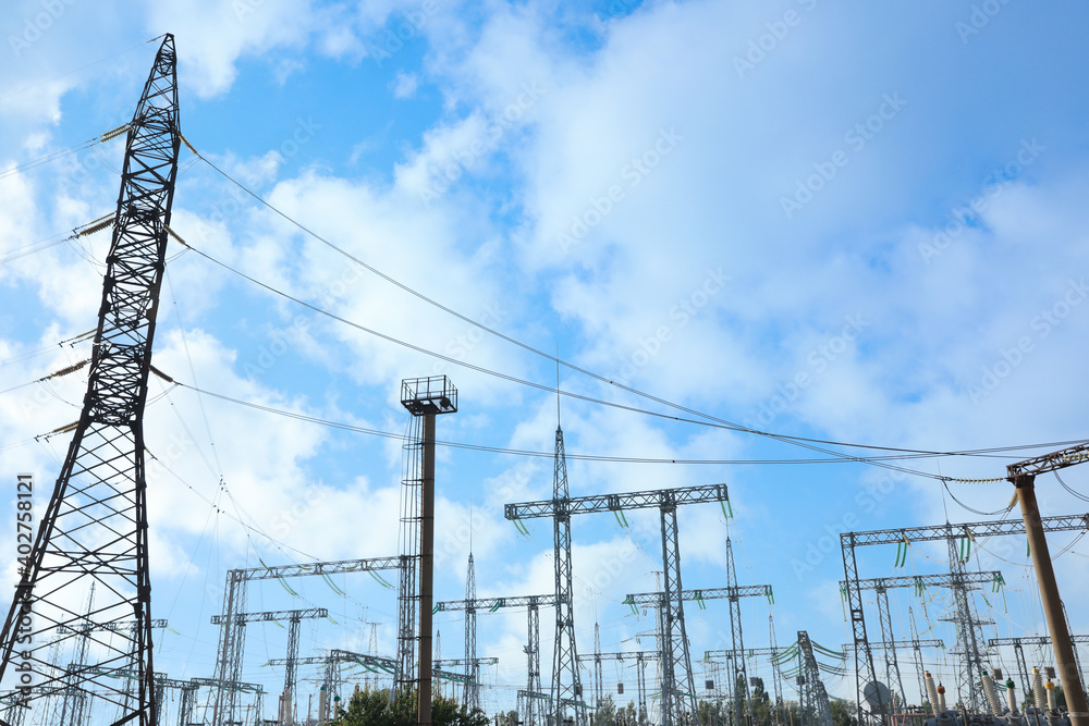 Modern electrical substation on sunny day, low angle view Modern electrical substation on sunny day, low angle view