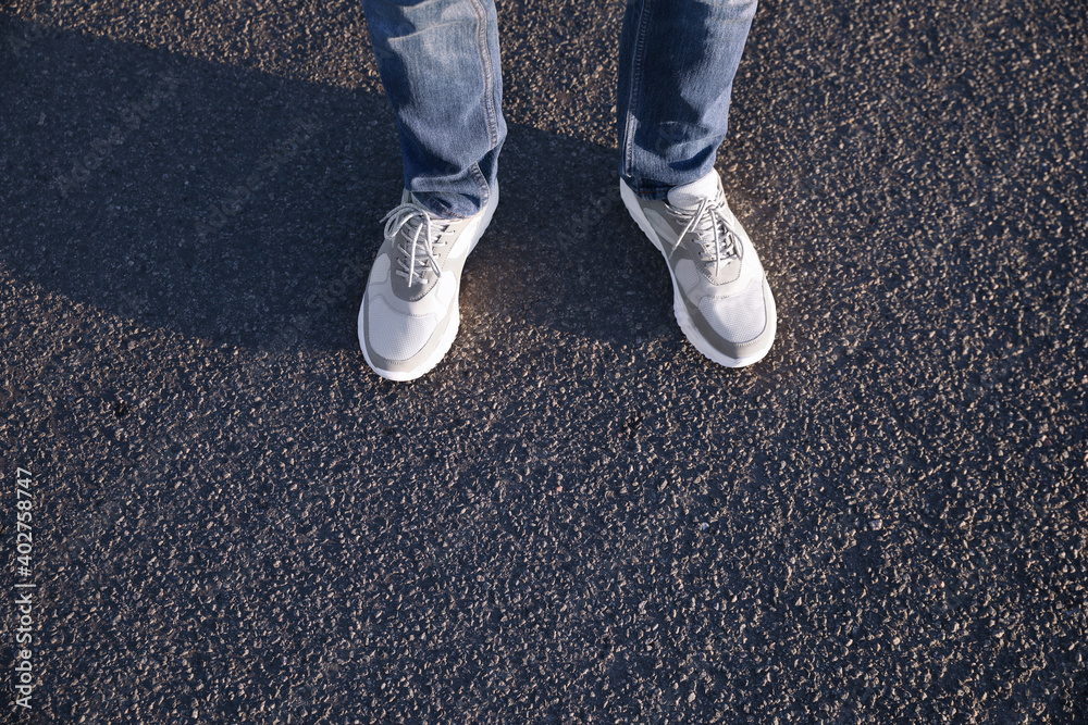 Man standing on road, closeup with space for text. Choosing way concept