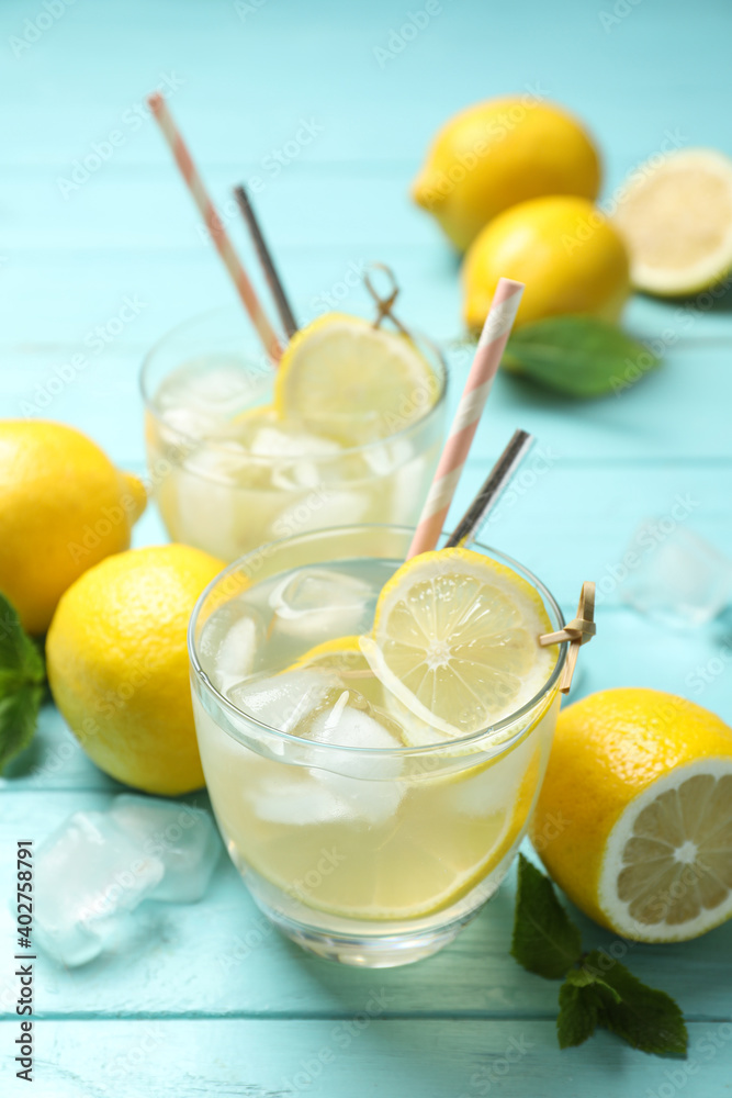 Natural lemonade and fresh fruits on light blue wooden table. Summer refreshing drink Natural lemonade and fresh fruits on light blue wooden table. Summer refreshing drink