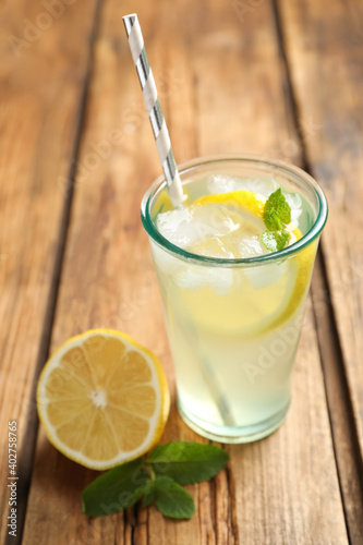 Natural lemonade with mint and fresh fruit on wooden table, closeup. Summer refreshing drink