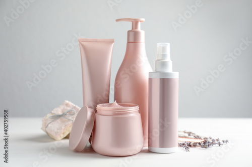 Set of hair care cosmetic products on white table photo