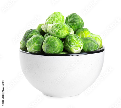 Fresh Brussels sprouts in bowl isolated on white