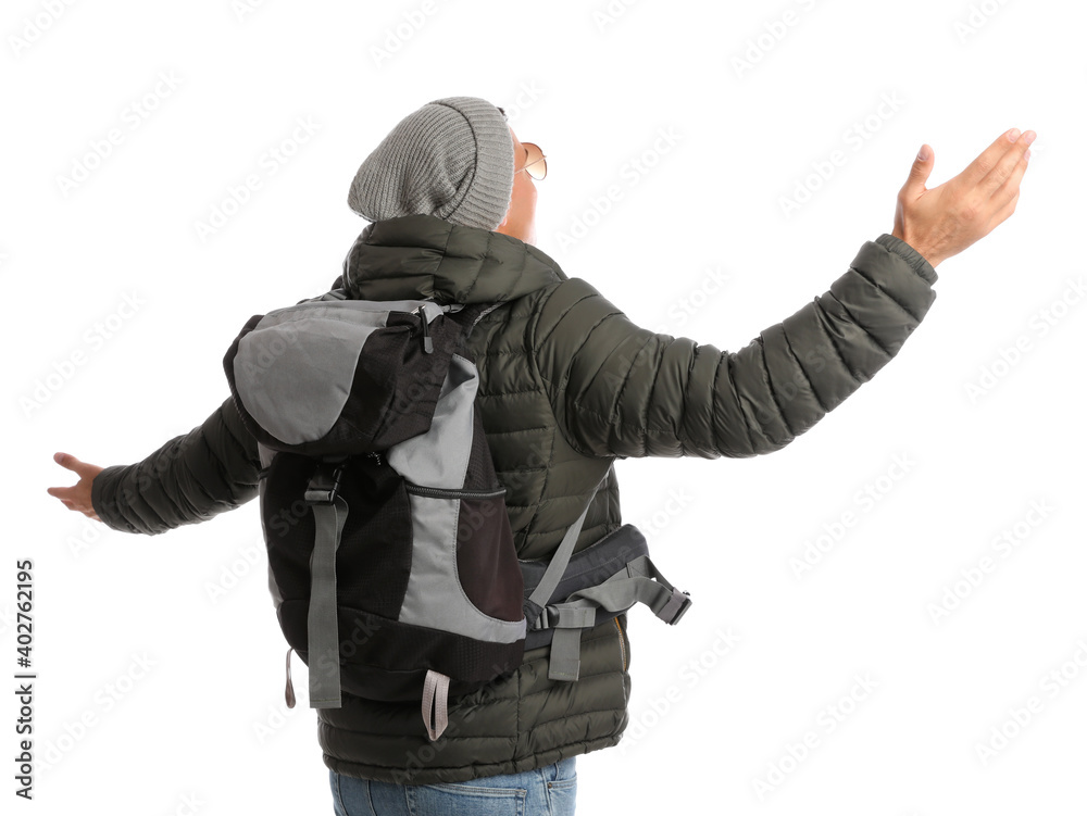 Man with backpack on white background, back view. Winter travel