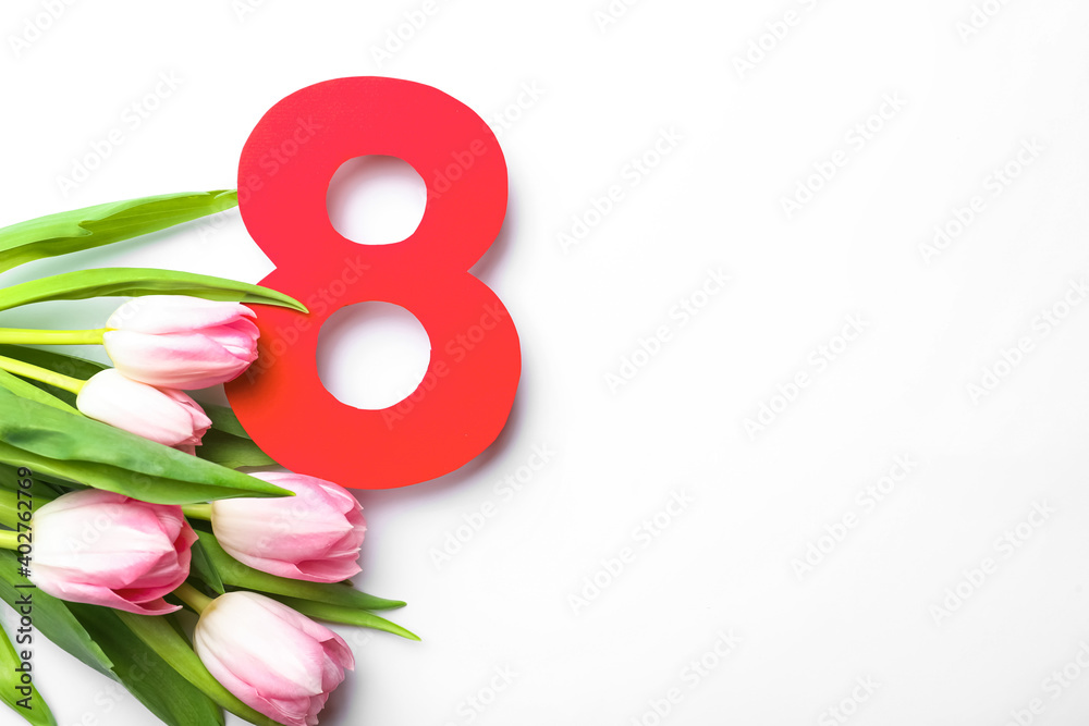 Fototapeta premium 8 March greeting card design with tulips on white background, top view. Space for text