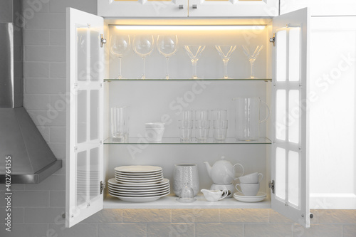 Принти на полотні Cabinet with crockery and glassware. Order in kitchen