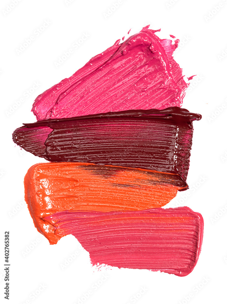 Four Shades of Lipstick and Lip Gloss Swatches on a White Background Four Shades of Lipstick and Lip Gloss Swatches on a White Background