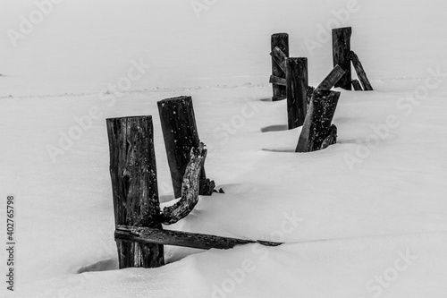 Fence buried in the snow in Kawuneeche Valley in Rocky Mountain National Park photo