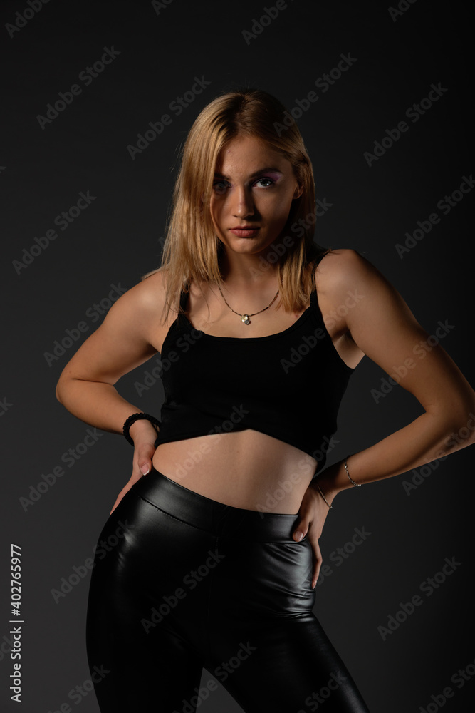 Sexy blonde in leather black pants going crazy. Sexy blonde in leather black pants going crazy.