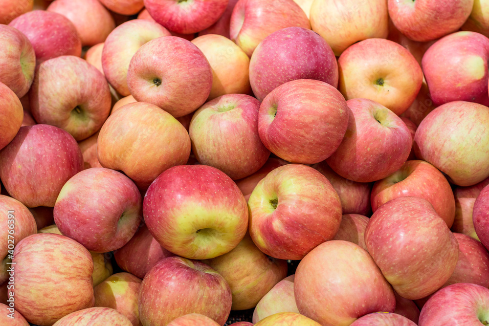 A pile of fresh red apple for sale in the market A pile of fresh red apple for sale in the market