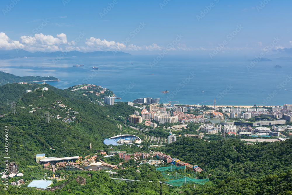 Fototapeta premium Beautiful coastline and villas in Shenzhen Bay against cloudy sky , View from Overseas Chinese Town East (OCT East ) in Shenzhen, Guangdong, China.
