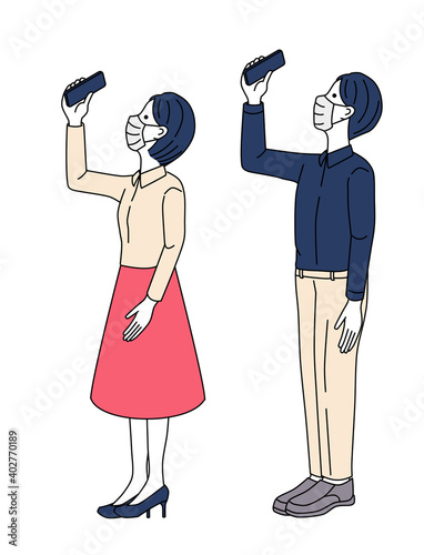 A couple taking pictures with a smartphone