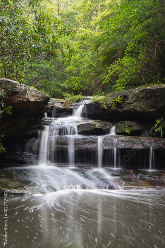 Fototapeta Naklejka Na Ścianę i Meble -  Small cascade waterfall in rainforest area.