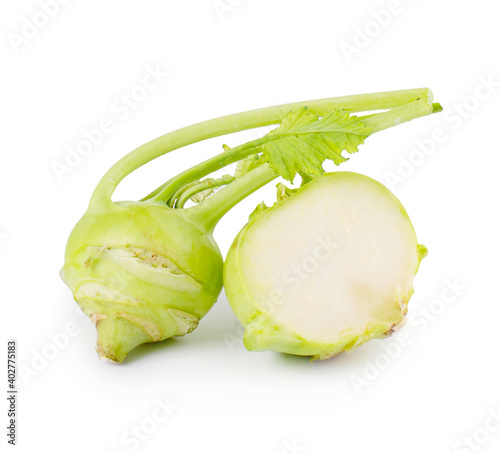 Fresh kohlrabi with green leaves on isolated white background photo