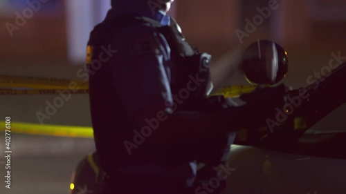 Police Woman Putting on her Gloves at Crime Scene with Siren Flashing 4K