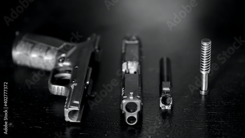 a field stripped pistol with upper and lower components on display.