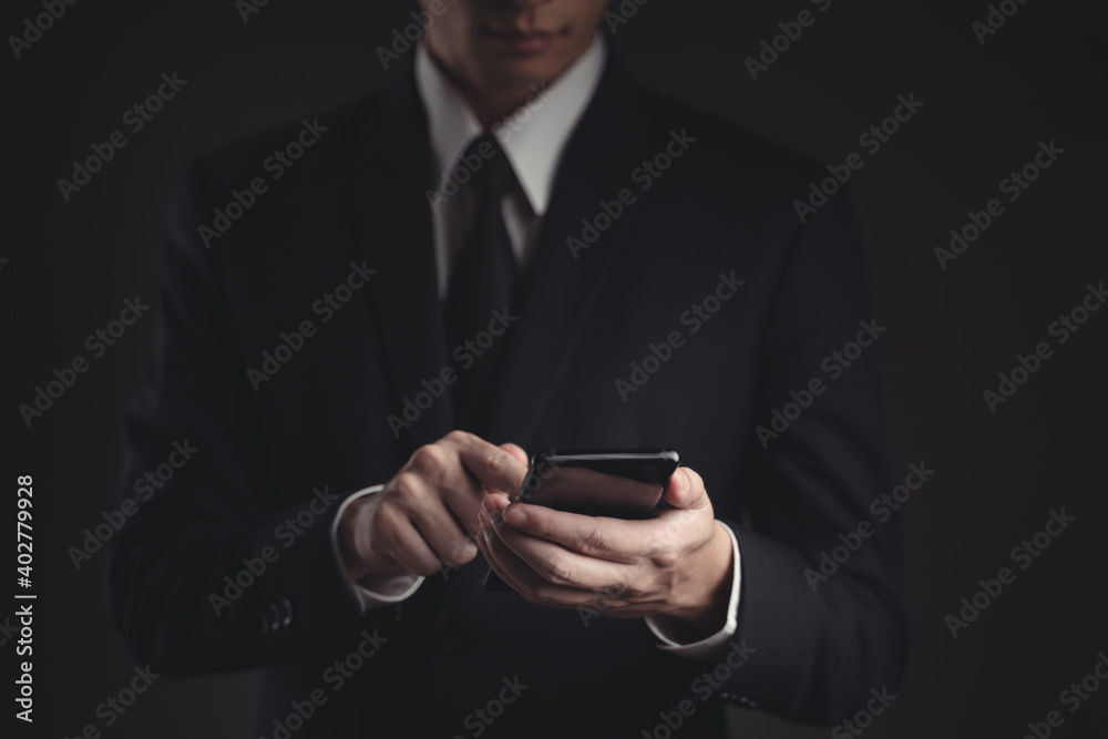 Hands typing message on smart phone.