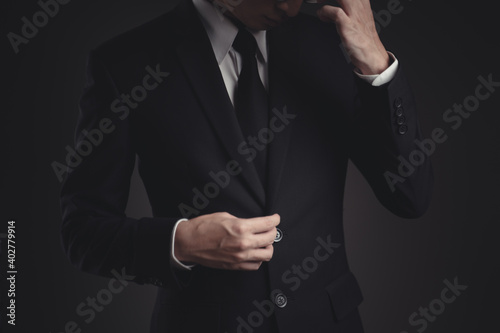Close up shot of businessman in black suit. © chajamp