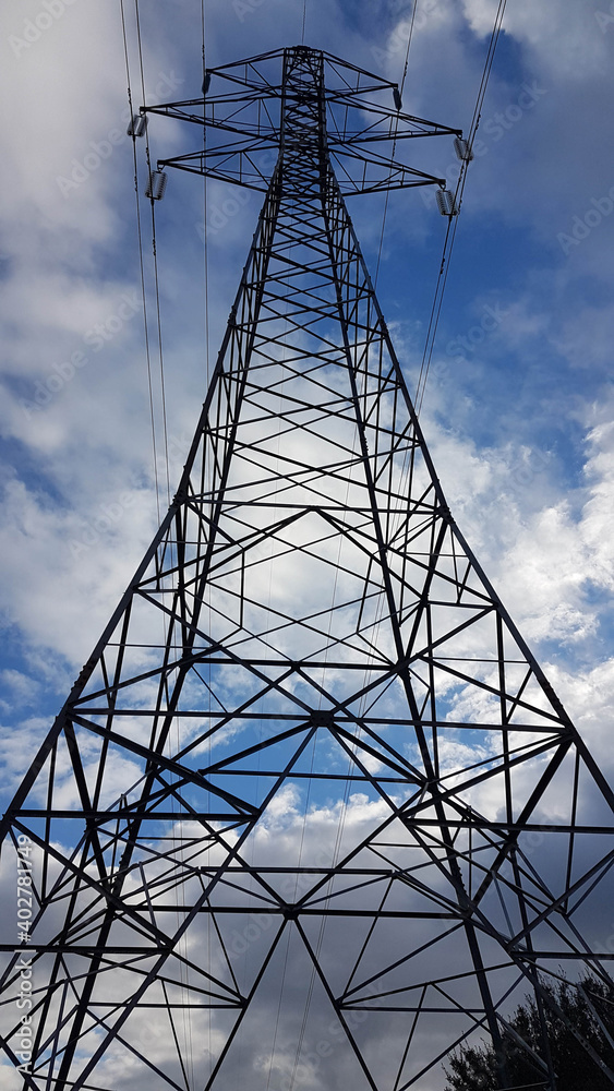 electricity pylons cords blue sky clouds electricity pylons cords blue sky clouds
