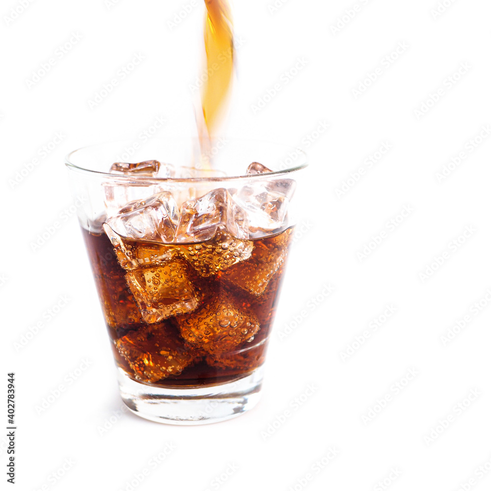 Close-up Cola in glass with ice on white background.