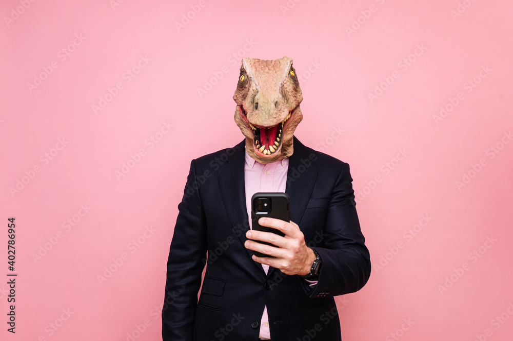 Lizard-headed man using smartphone. Lizard-headed man using smartphone.