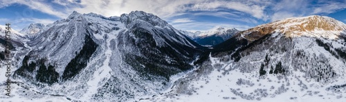 A very large aerial panorama from a drone of winter mountains and snow-capped hills. Location Dobay, Russia