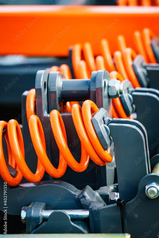 Industrial spring at agricultural machine