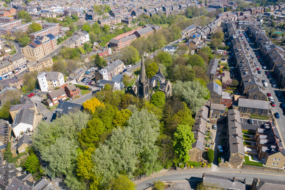 Aerial photo of the village of Morley in Leeds, West Yorkshire in the UK, showing an aerial drone view of the main street and historical old town hall and clock tower