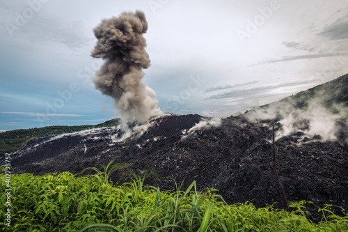 Smoke rising from Ibo volcano, Halmahera, Indonesia photo