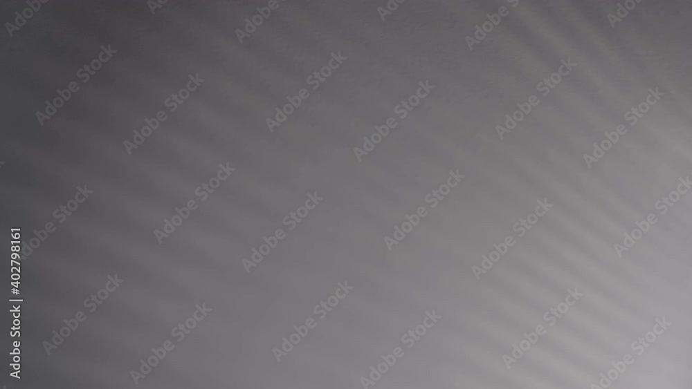 Blurry dark shadows moving on the wall. Spooky shadow art noise texture. closeup the motion of shadow batten of lath light on white wall texture background. Slow motion video. stock footage Blurry dark shadows moving on the wall. Spooky shadow art noise texture. closeup the motion of shadow batten of lath light on white wall texture background. Slow motion video. stock footage