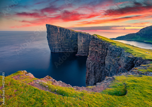 Beautiful summer scenery. Exciting summer view from flying drone of Sorvagsvatn lake, Vagar, Faroe Islands, Europe. Marvelous summer sunset on Atlantic Ocean. photo