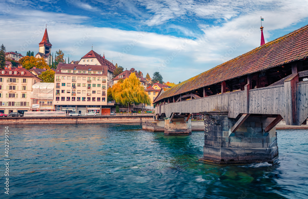 Famous old wooden Spreuer Bridge, 15th-century, covered pedestrian bridge featuring a series of paintings with a death motif. Lucerne cityscape, Switzerland, Europe. Traveling concept background.