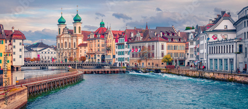 Сharm of the ancient cities of Europe. Panoramic morning view of Jesuitenkirche Church. Beautiful  autumn cityscape of Lucerne. Stunning outdoor scene of Switzerland, Europe. #402799114