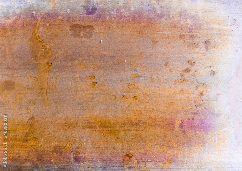 Colorful abstract background. Rusty aged texture. Yellow purple distressed surface with grainy splotches dirt dust scratches. Dry acrylic paint drip creative design.