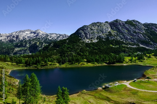amazing mountain lake with mountains and green nature © thomaseder