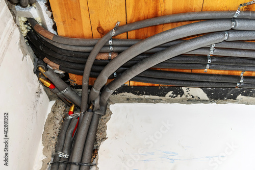 Heat insulating pipes. Laying communications for the home heating system. Close-up