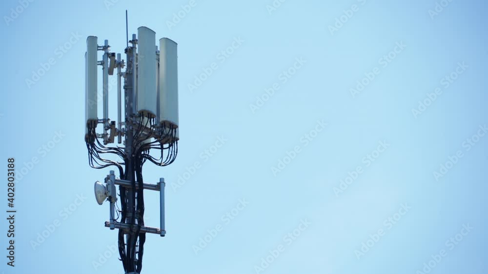 Signal or mobile phone tower against blue sky. Radio antenna. Modern telecommunication by using 5g or 4g internet. Signal or mobile phone tower against blue sky. Radio antenna. Modern telecommunication by using 5g or 4g internet.