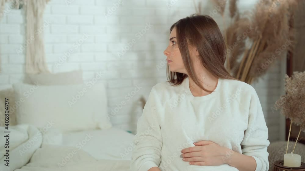 a pregnant woman is in a bad mood and waits for her husband to pay attention to her a pregnant woman is in a bad mood and waits for her husband to pay attention to her