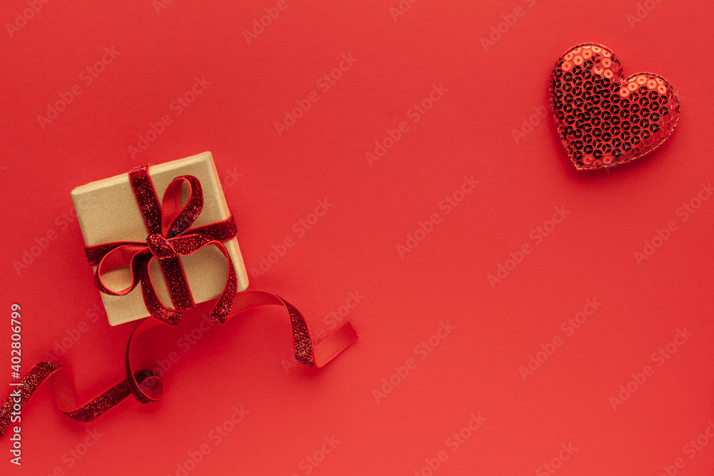 Festive composition with gift box and hearts on red background. Top view, copy space. Valentine's day concept. Festive composition with gift box and hearts on red background. Top view, copy space. Valentine's day concept.