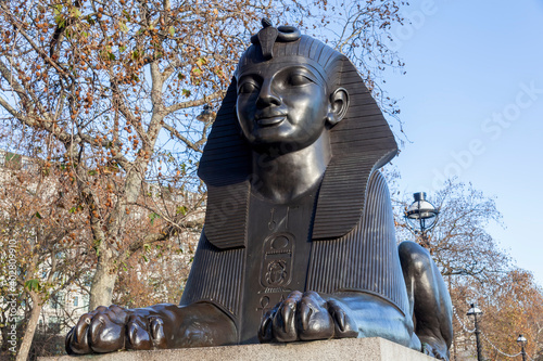 One of two Sphinx guarding Cleopatra's Needle on Victoria Embankment in London England UK erected in 1878 and is a popular tourist travel destination attraction landmark, stock photo image photo
