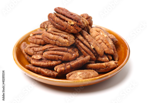 Peeled pecan nuts closeup, isolated on white background