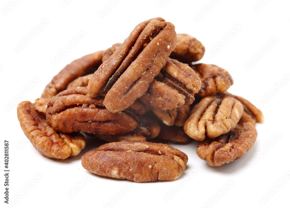Peeled pecan nuts closeup, isolated on white background Peeled pecan nuts closeup, isolated on white background