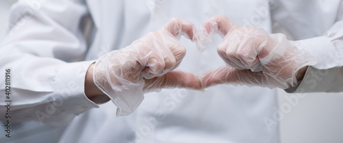 heart sign shown with gloved hands