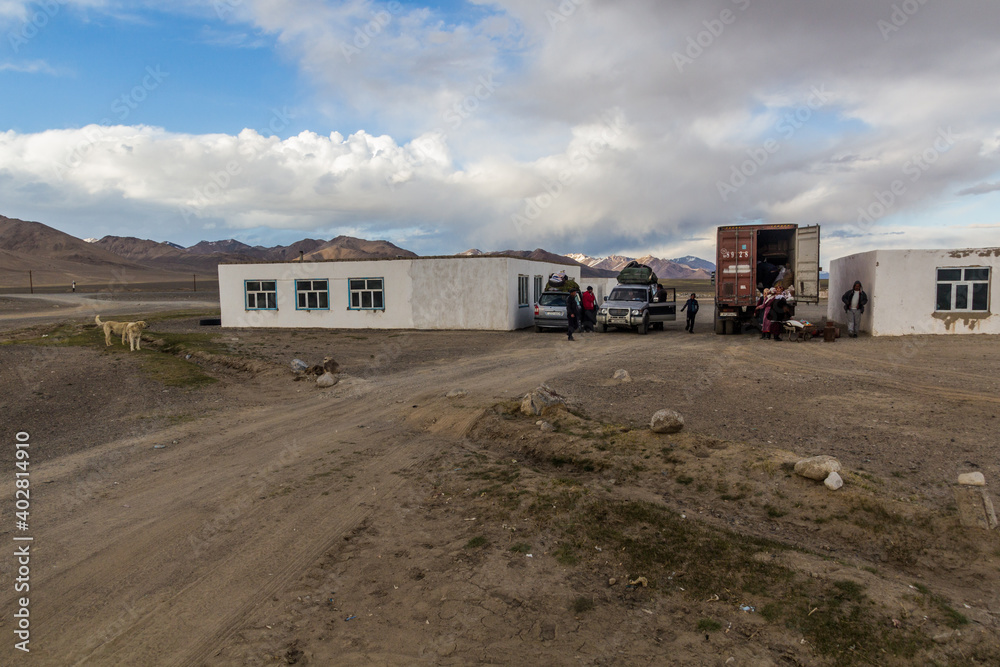 PAMIR HIGHWAY, TAJIKISTAN - MAY 26, 2018: Vehicles at a highway rest in Alichur village in Gorno-Badakhshan Autonomous Region, Tajikistan