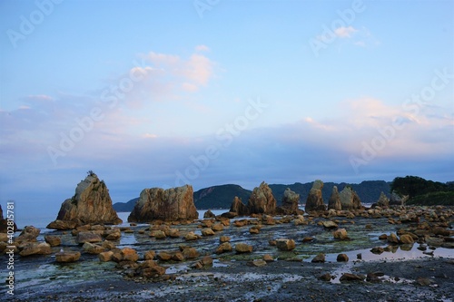 Hashikuiiwa Rocks in a row towering over the seashore from Kushimoto heading towards Oshima in Wakayama, Japan - 橋杭岩 串本町 和歌山県 日本