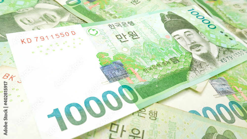Korean money 10,000 Won cash currency background. The concept of Korean cash currency. Korean money 10,000 Won cash currency background. The concept of Korean cash currency.