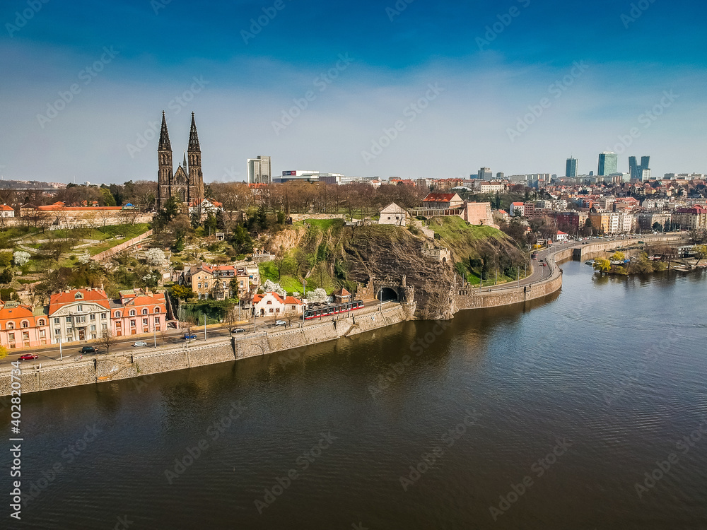 Cathedral Basilica of St Peter and St Paul oin Vysehrad fortress above the river Moldau with skyscrapers in background