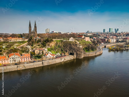 Cathedral Basilica of St Peter and St Paul oin Vysehrad fortress above the river Moldau with skyscrapers in background