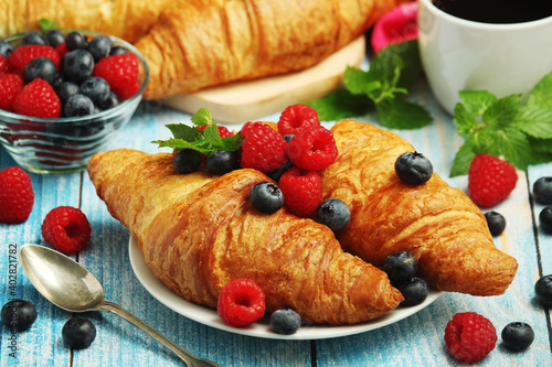 Croissants with fresh berries for breakfast