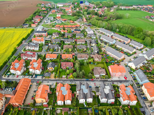 Nupaky, Czech republic - May 20, 2019. New row houses with old part of village in background photo