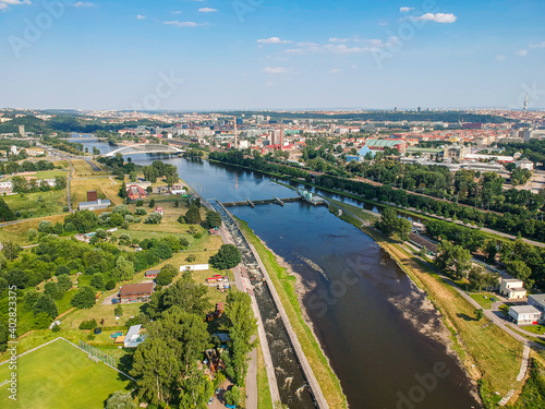 Moldau river in Troja area with architectonic bridge in background